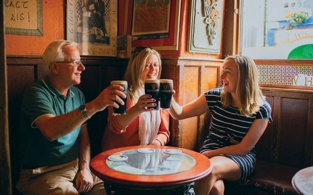 Friends enjoying a cozy Dublin pub